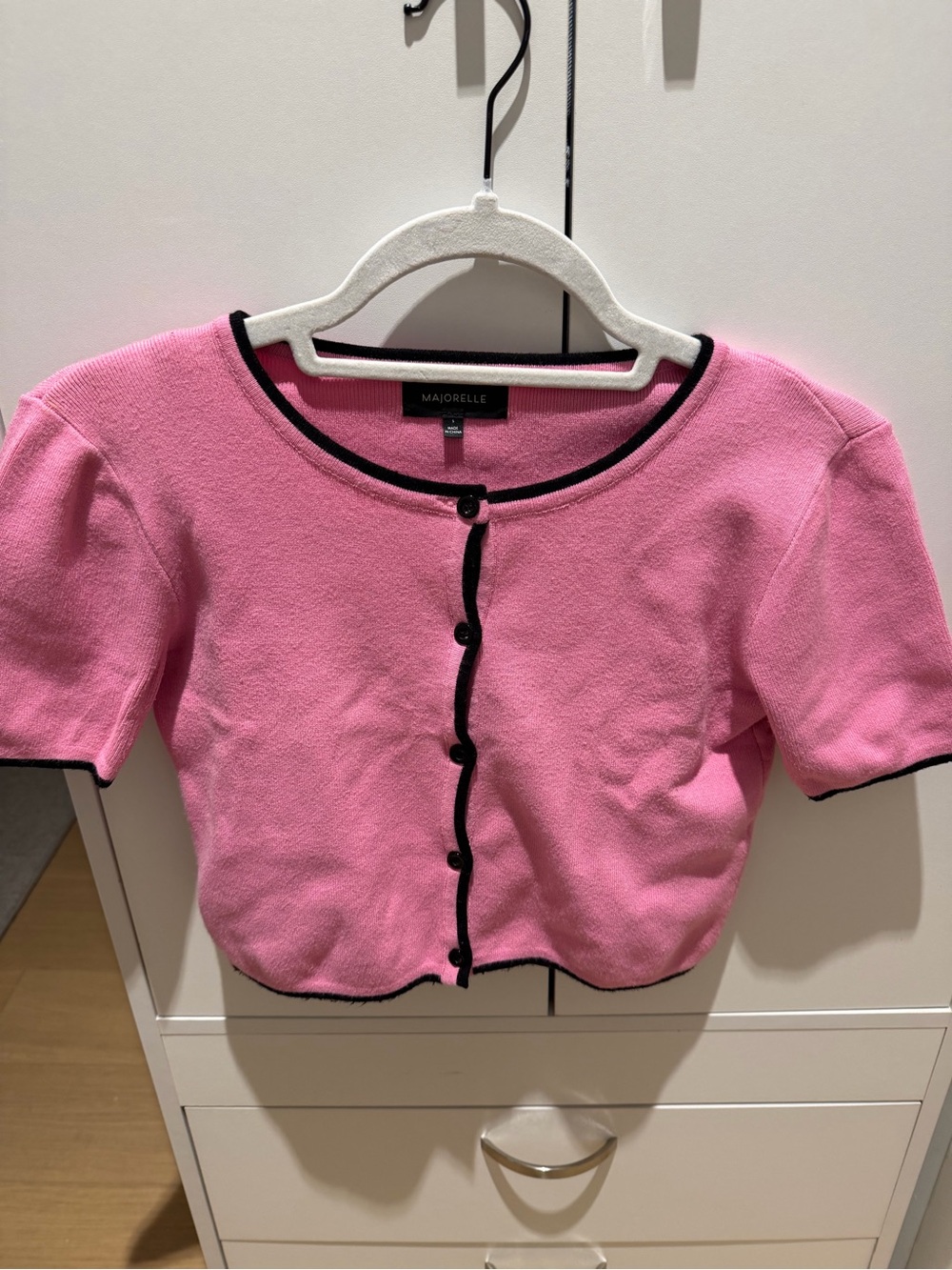 Majorelle Pink Short-Sleeve Cardigan with Black Trim, and bra like shirt under